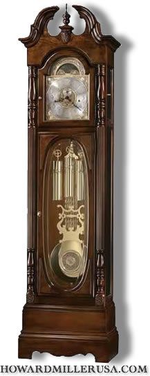 The elegant swan neck pediment of this fine grandfather clock 