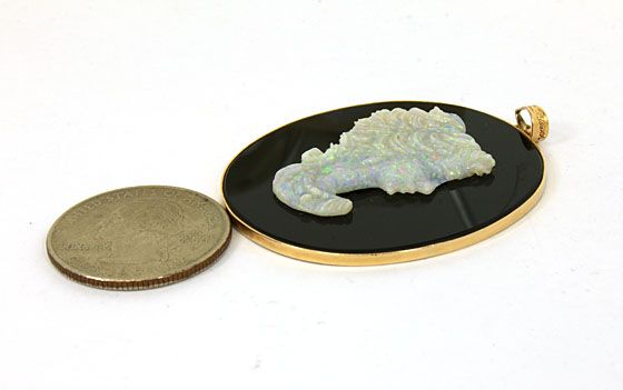 this is a vintage 14k gold and hand carved opal cameo ladies